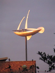 Miles Peppers Dream Ship sails above the Beacon Hill library at sunset. Photo by Wendi.