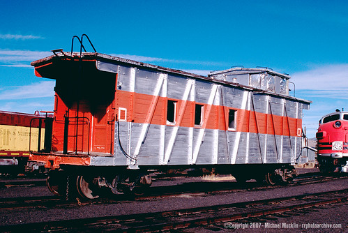 Old western Pacific wooden steam era caboose in modern 1950's era silver and orange paint. From the internet. by Eddie from Chicago