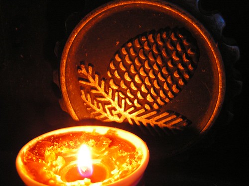candle and pinecone knob