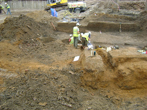Looking north across Zone 2; Tom in a soak-away, Lukasz clearing modern drains