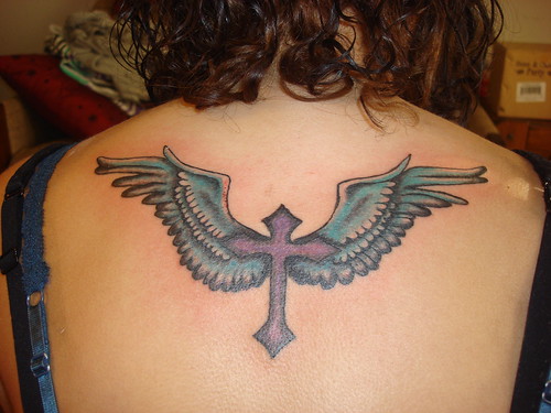 cross tattoos with wings on back. Women Cross Tattoos Designs
