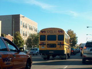 Southbound school bus on North western Avenue during the late afternoon rush hour. Chicago Illinois. October 2007.