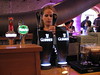 A barmaid pours a pint of Guinness