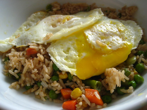 fried eggs over fried rice 