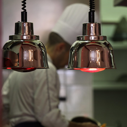 Sideview of chef cooking in a kitchen 