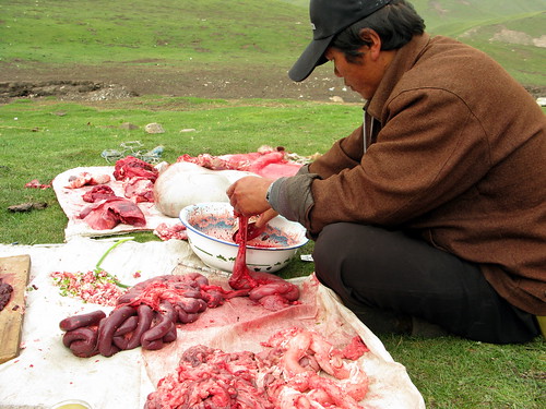 Butchering a sheep Tibetan style near Erbou, Qinghai Province, China
