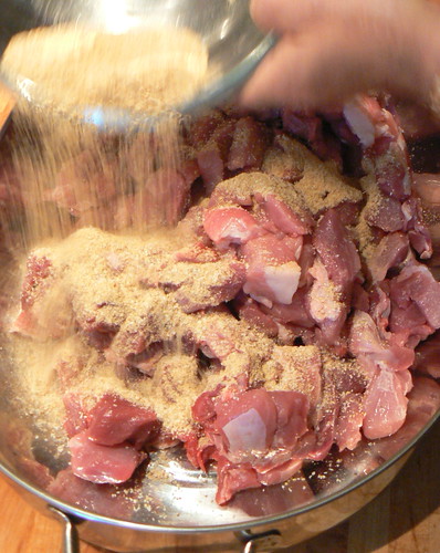Adding seasoning to pork