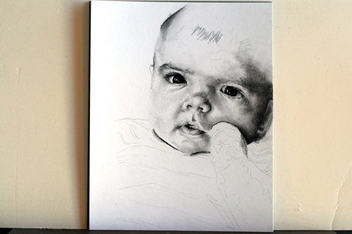 In progress photo of carbon pencil drawing entitled Emre at 4 Months
