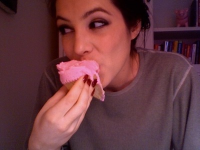 Julia Allison eats a cupcake