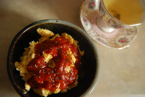 Scrambled eggs with ketchup and tea