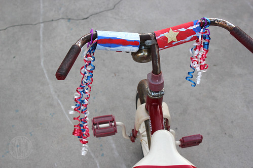 Patriotic streamers attached to bicycle handles 