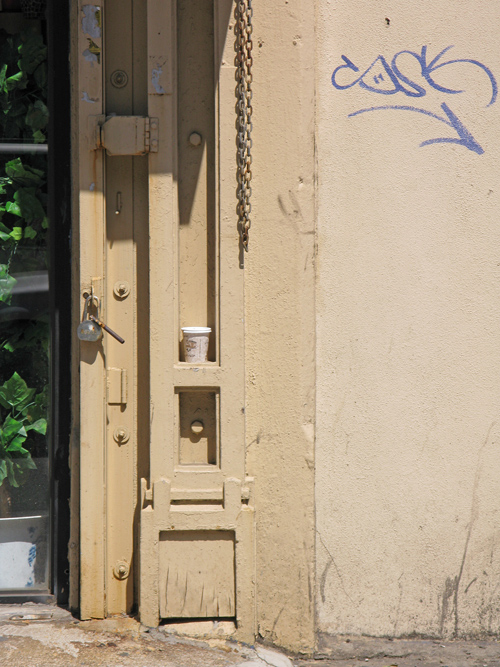 a composition with an entrance, a cup, and graffiti, Manhattan, NYC