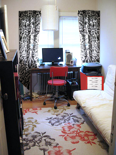 With red ikea filing cabinet and black and white curtains from the old 