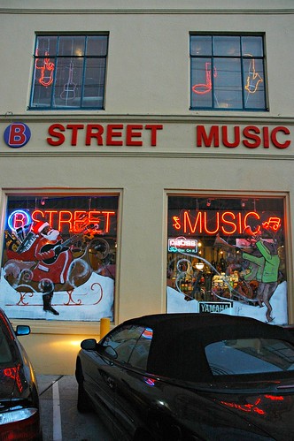 B Street Music rocking with Santa playing a guitar and Rudolph on the horns
