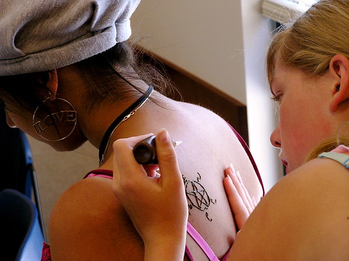 Teens gathered for the history of henna 