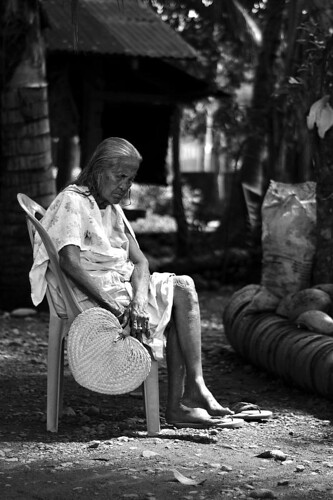 An elderly woman rests on a chair Saranggani Mindanao Philippines Buhay Pinoy  Ngayon Filipino Pilipino  people pictures photos life Philippinen      