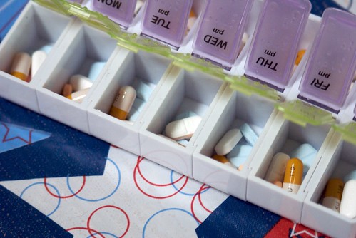 A pill sorter filled with medications for the treatment of depression and bipolar disorder.