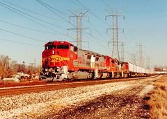 Westbound Atchinson, Topeka & Santa Fe intermodal train. Forest View Illinois. December 1990.