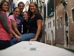 Erica Yoder, Michelle Lehman, Steven Rittenhouse, Sarah Harder, and Sarah Gant sit by a canal in Venice.