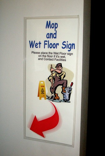 'mop and wet floor sign' sign