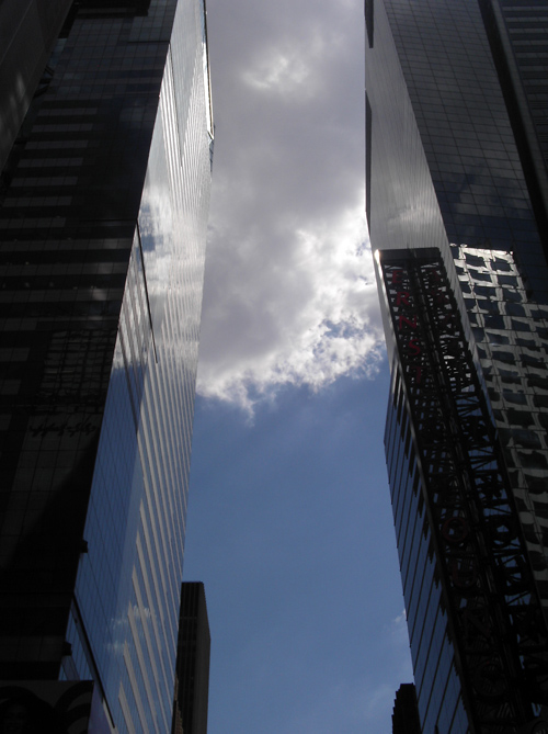 a Manhattan canyon with cloud cover, NYC