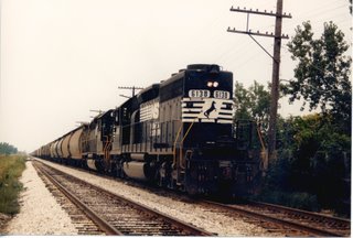 Southbound Norfolk Southern transfer train traveling over the Belt Railway of Chicago tracks at West 63rd Street. Chicago Illinois. August 1988.