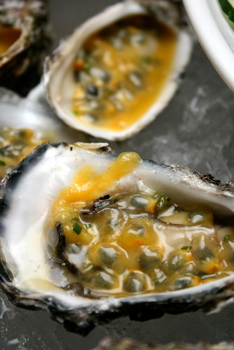 Oysters on ice with passion fruit