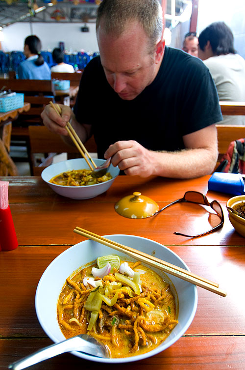Andy Ricker, chef/owner of Pok Pok, in Portland, Oregon, eating khao soi at Samoe Jai Fah Ham, Chiang Mai