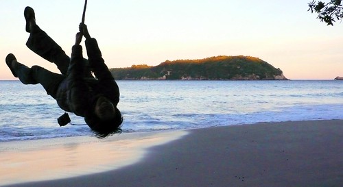 rope swing at sunset