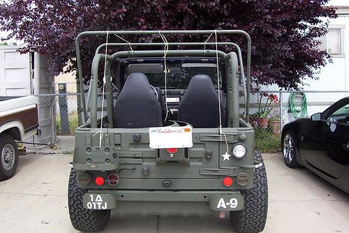 The high back was common on military jeeps because the rear seat was mounted 