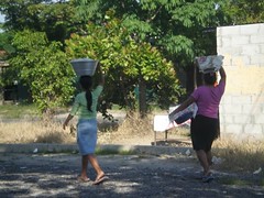 Women carrying buckets by Ms. Kathleen