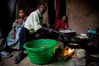 a young ugandan family cooks a meal