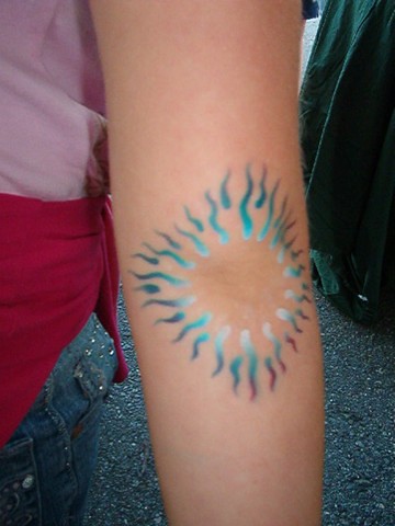 Sun Flames Airbrush Tattoo on elbow