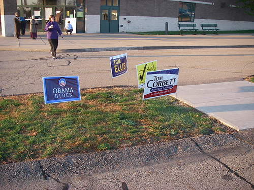 Some campaign signs outside the voting booth
