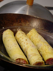 egg crepe rolls in wok