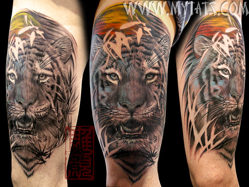 Realistic tiger tattoo on the thigh with some color, done by Jess Yen of My 