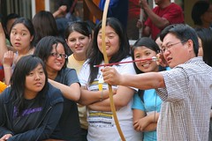 Gracepoint Fellowship Church Berkeley Pastor Ed Kang teaching people archery