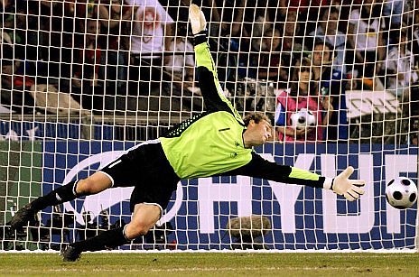 Germany's goalkeeper Jens Lehmann fails to save the ball from Portuguese forward Nuno Gomes