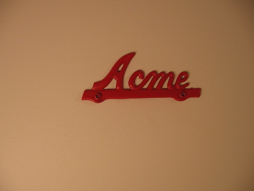 Acme sign on washroom door