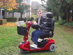 Glenda Watson Hyatt in her red mobility scooter