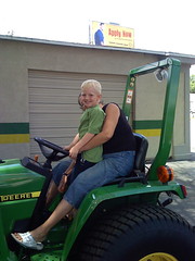 Grandma takes Zachary for a ride on the tractor