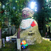 Statue with make-up and toy - Okunoin cemetary