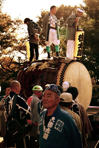 Men Parade With A Giant Taiko Drum