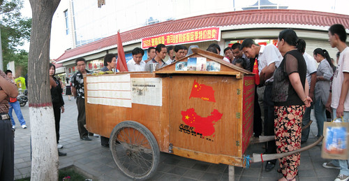 Human powered caravan of Chinese man walking around China (Jiuquan, Gansu Province, China)
