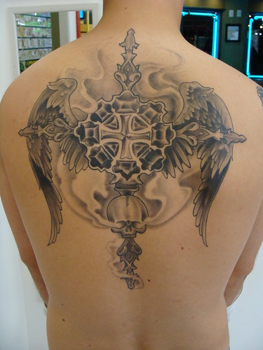 cross tattoos on back with wings. cross and wings tattoo.