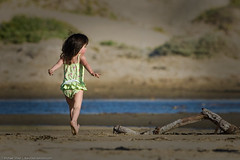 Small child runs on Morro Strand