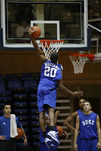 Freshman Elliot Williams soars for a dunk in Dukes open practice Friday. Photo by Chase Olivieri/The Chronicle