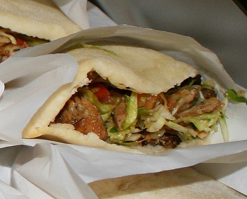 Chicken shawarma - grilled chicken, mixed vegetables, tahini sauce in pita pocket