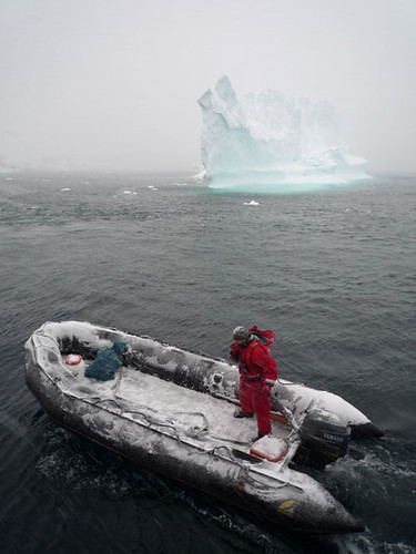 Travelling past an iceberg that is melting from rising sea temperatures