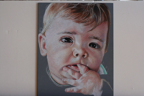 In progress photo of colored pencil drawing entitled Emre at 7 Months